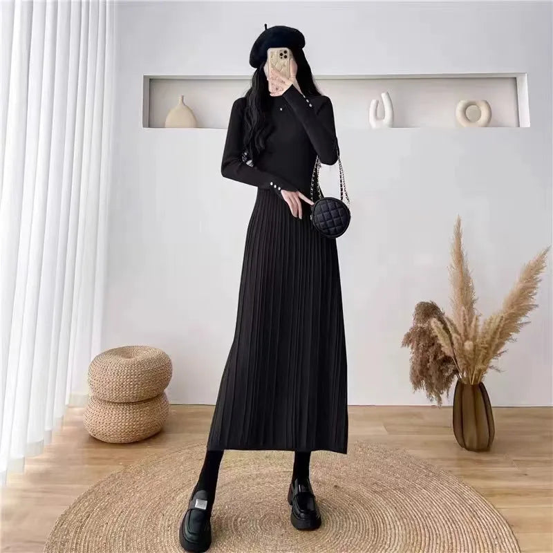 Women's beige high-waist acrylic knit A-line midi dress with regular sleeves on a hanger.