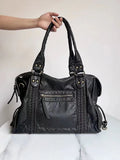 Women's retro motorcycle shoulder bag in bright black with golden edge or brown, showing internal compartments and slit pockets