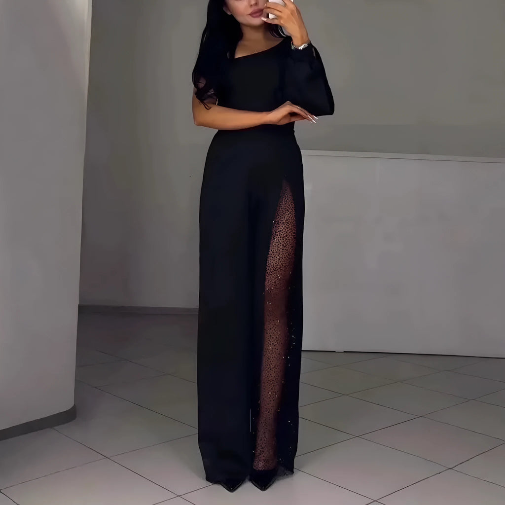 Black women's jumpsuit with one oblique shoulder and a high slit on the leg