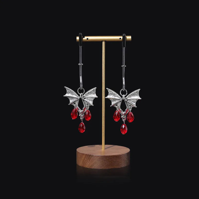 Silver alloy bat nipple clamp with red ruby bat clip decoration.
