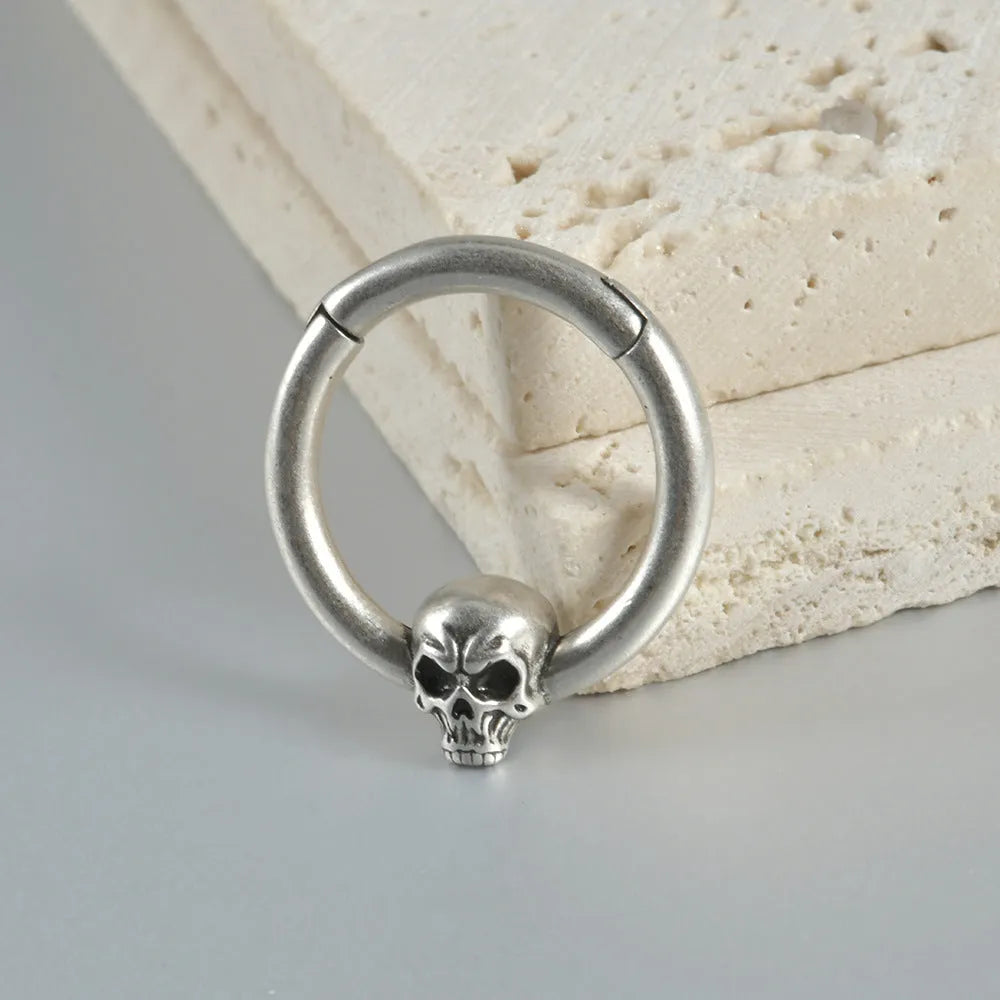 Antique silver and gold punk copper earrings with ghost head designs