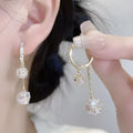 Silver drop earrings with a rhinestone ball and colourful balloon tassel pendant.