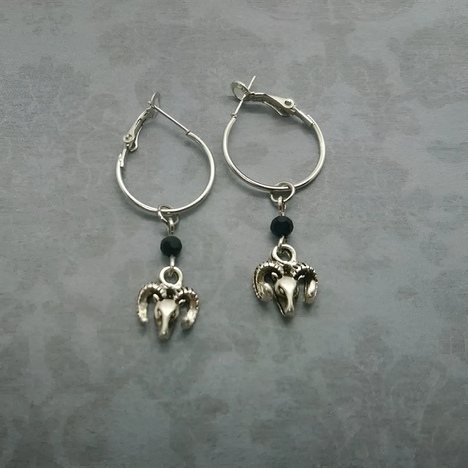Silver tone alloy round ring earrings with Tibetan antelope design for women