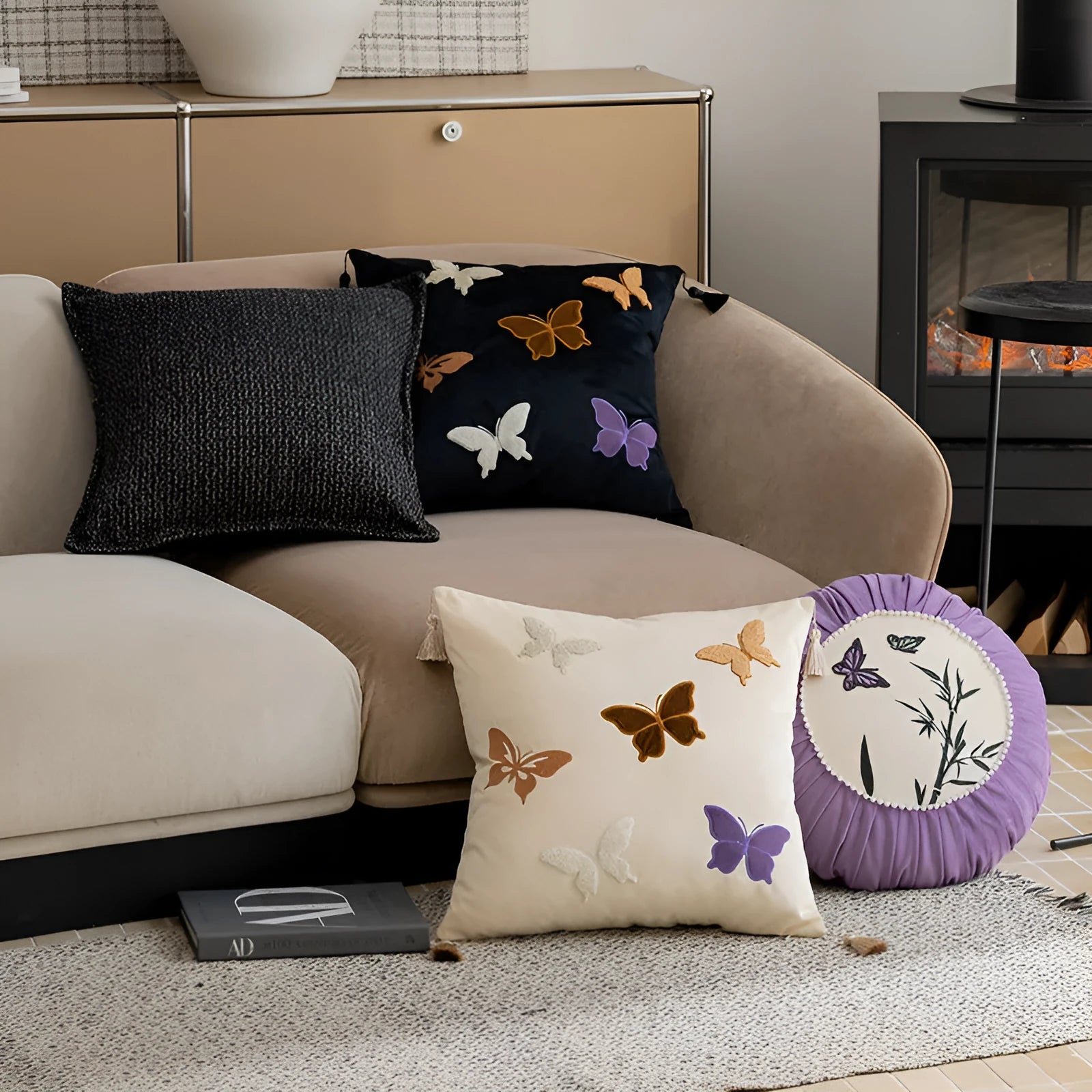 Square beige cushion with detailed purple and black butterfly embroidery in a Chinese floral pattern.