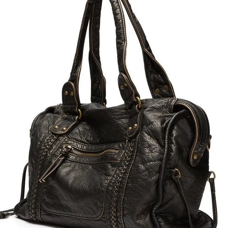 Women's retro motorcycle shoulder bag in bright black with golden edge or brown, showing internal compartments and slit pockets