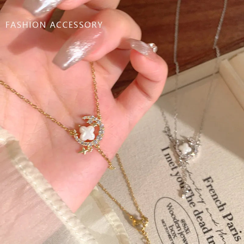 Gold or silver women's necklace with star moon pendant and sparking stones on a copper chain.