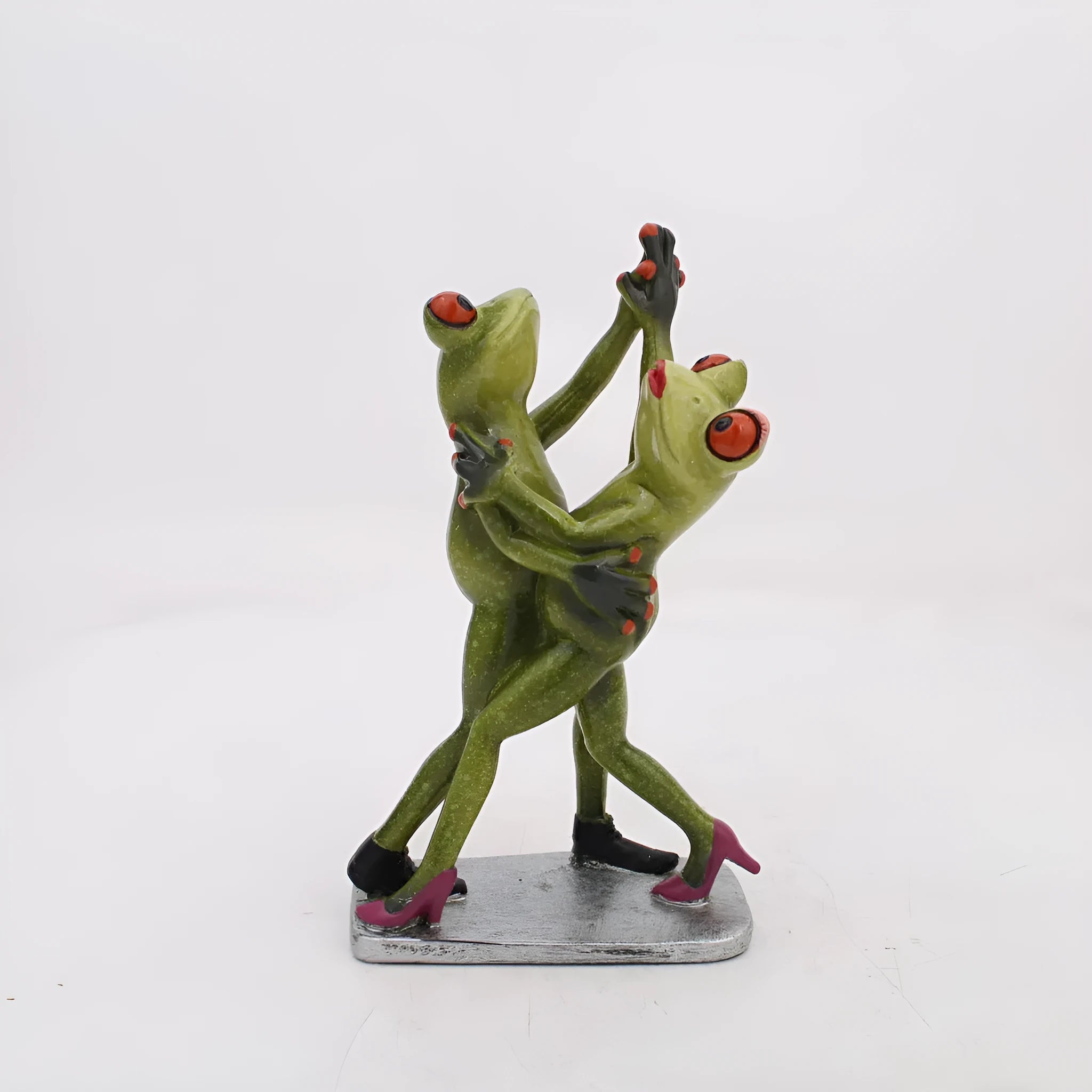 Synthetic resin pastoral style frog figurine home decoration ornament on a surface.
