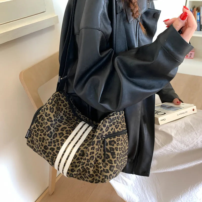 Leopard print sports messenger shoulder bag with stitching details