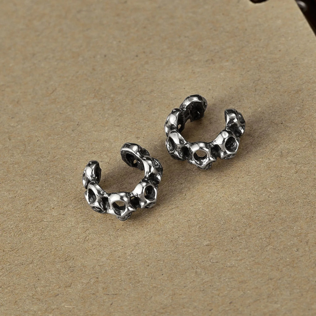 Stainless steel geometric skull ear clips with hollow design and electroplated finish