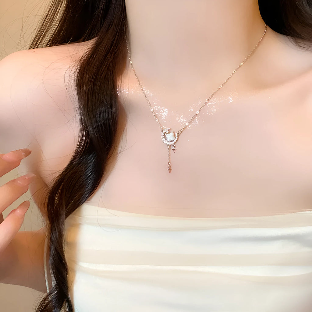 Gold or silver women's necklace with star moon pendant and sparking stones on a copper chain.