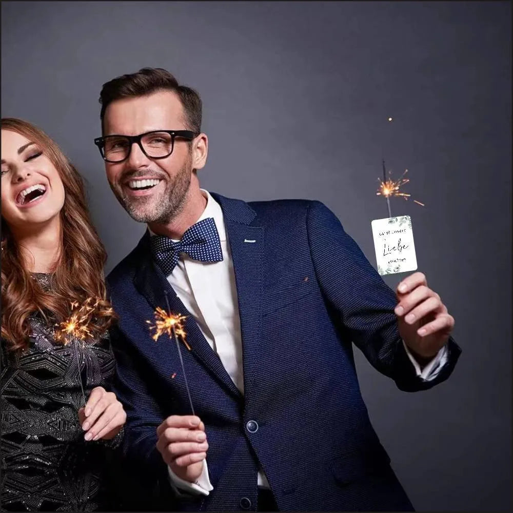 Pack of 50 white decorative paper labels with Fireworks and I Make Love print for events.
