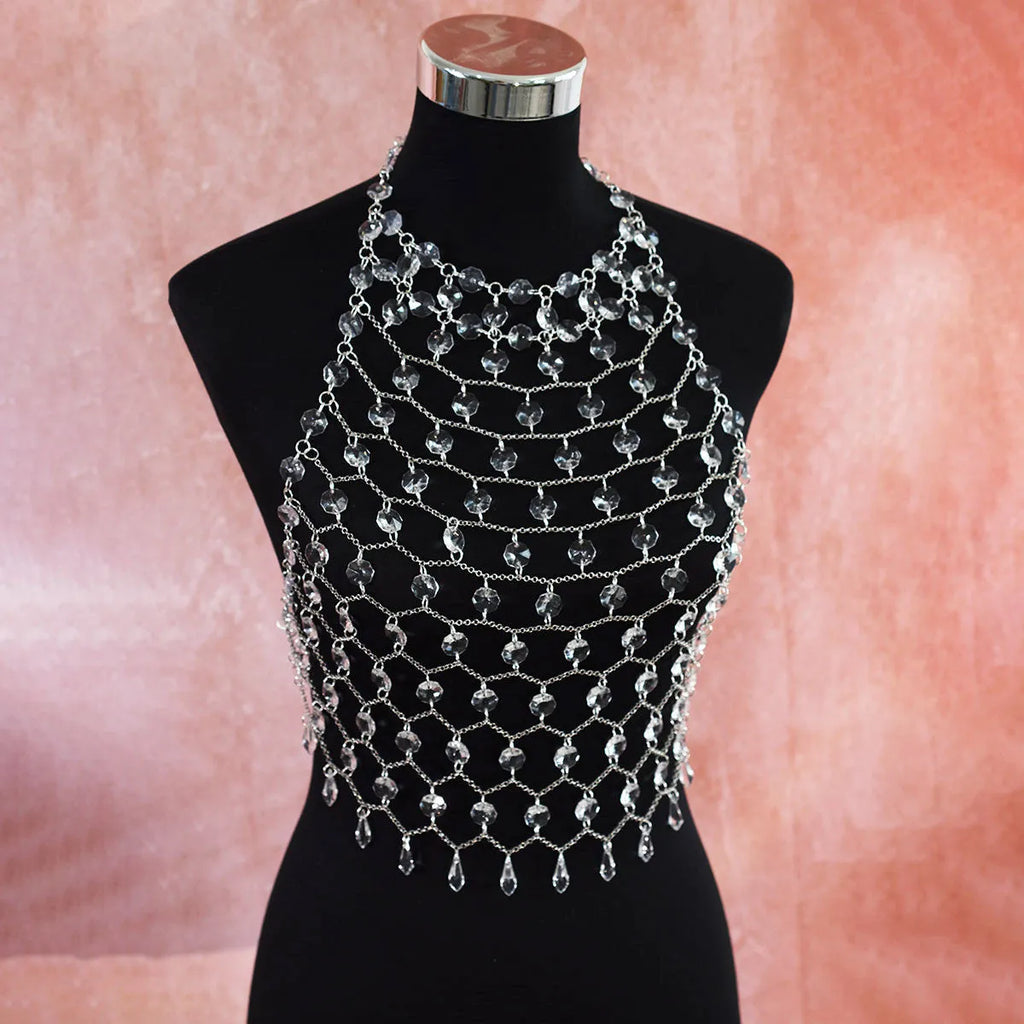 Hand-woven transparent acrylic crystal sequins body chain chest necklace in round shape on display