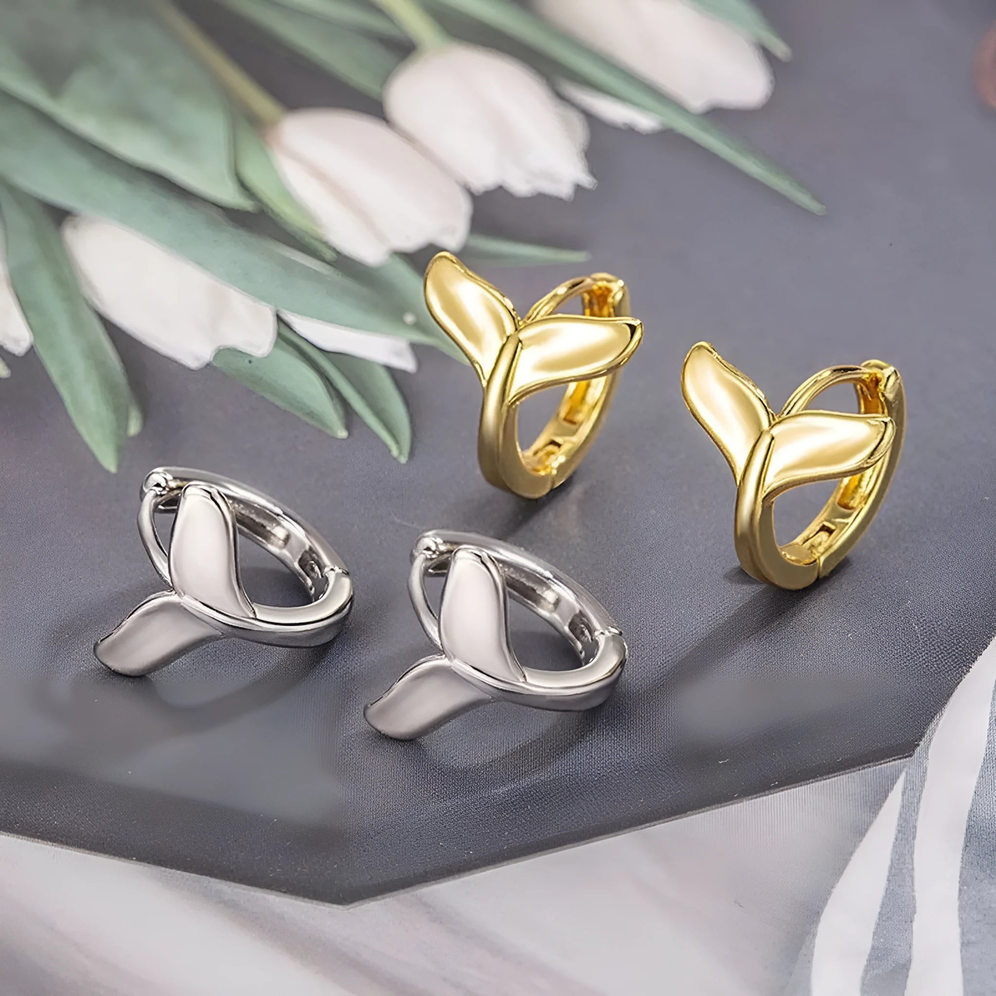 Women's fashion fishtail earrings in electroplated white gold or yellow gold colour on copper base