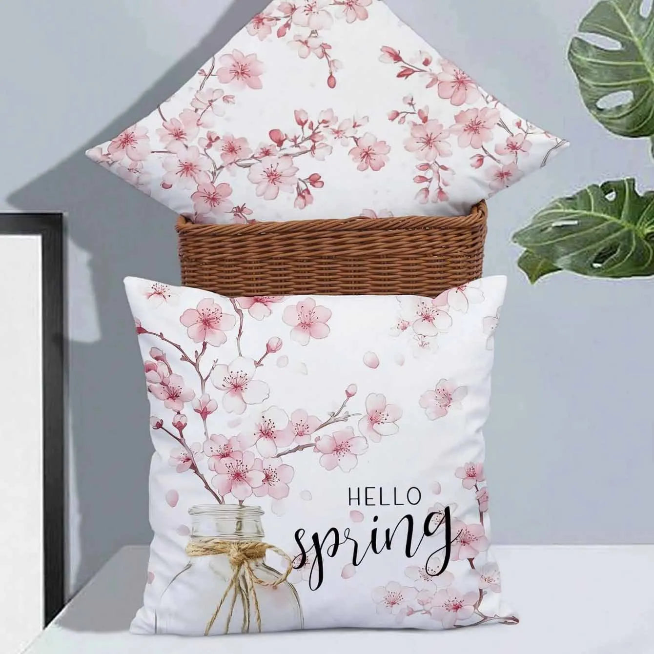 45cm square short velvet cushion cover with printed cherry blossom and letter design.