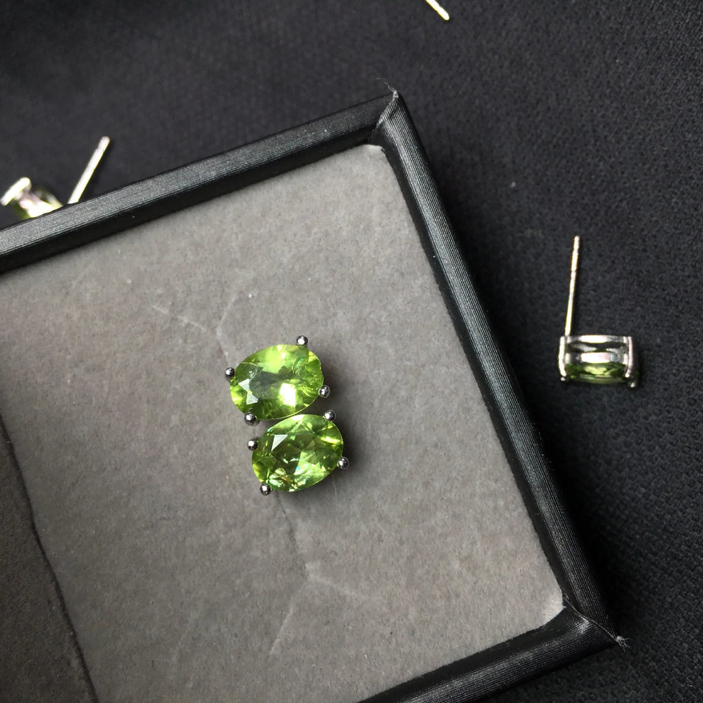 Grass green natural olivine stud earrings in sterling silver, elliptical stones 6x8mm.