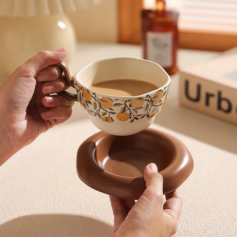 Antique-style ceramic coffee cup and saucer set in black or orange with 210ml capacity