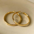 Metal circle earrings with gold or silver electroplated finish measuring 40mm diameter