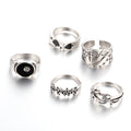 Black alloy adjustable ring with a raised retro spade card symbol design.