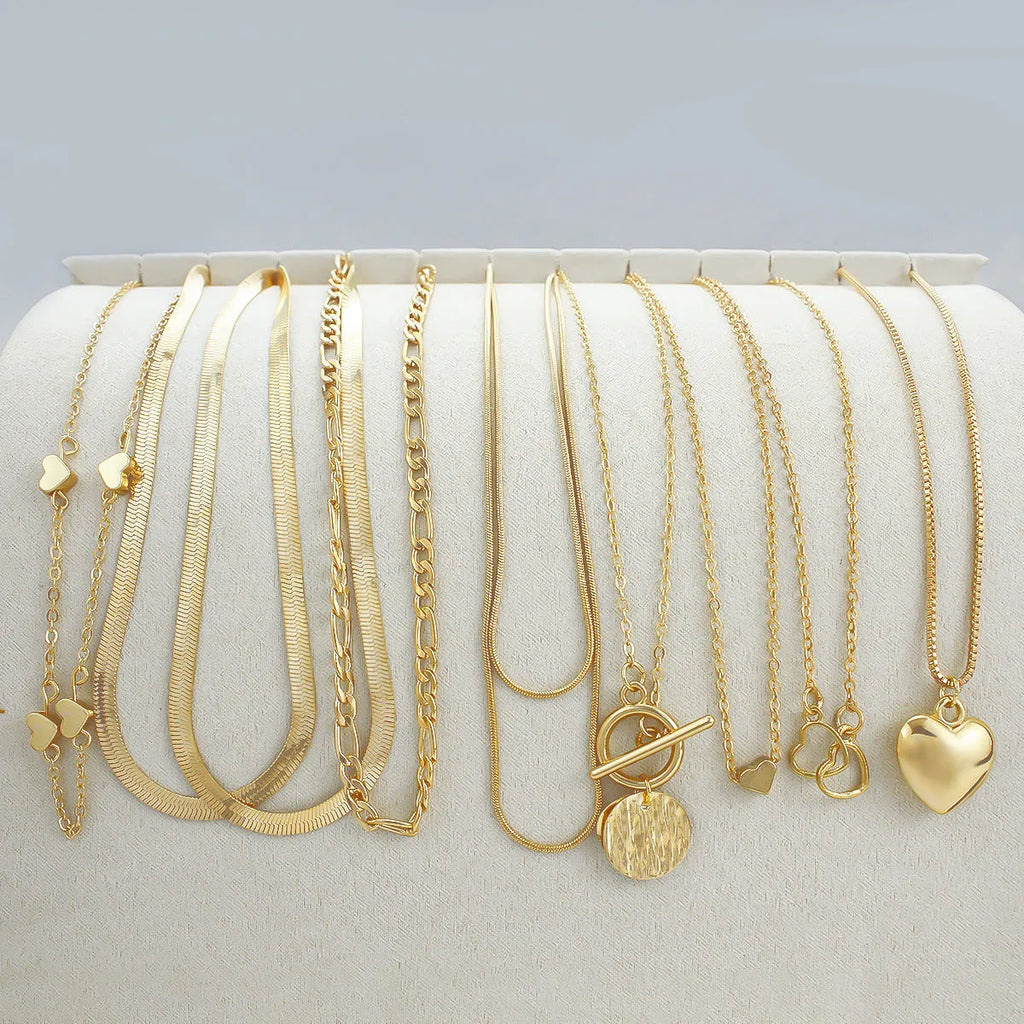 10-piece women's jewellery set with gold necklace featuring alloy pendant on snake bones chain