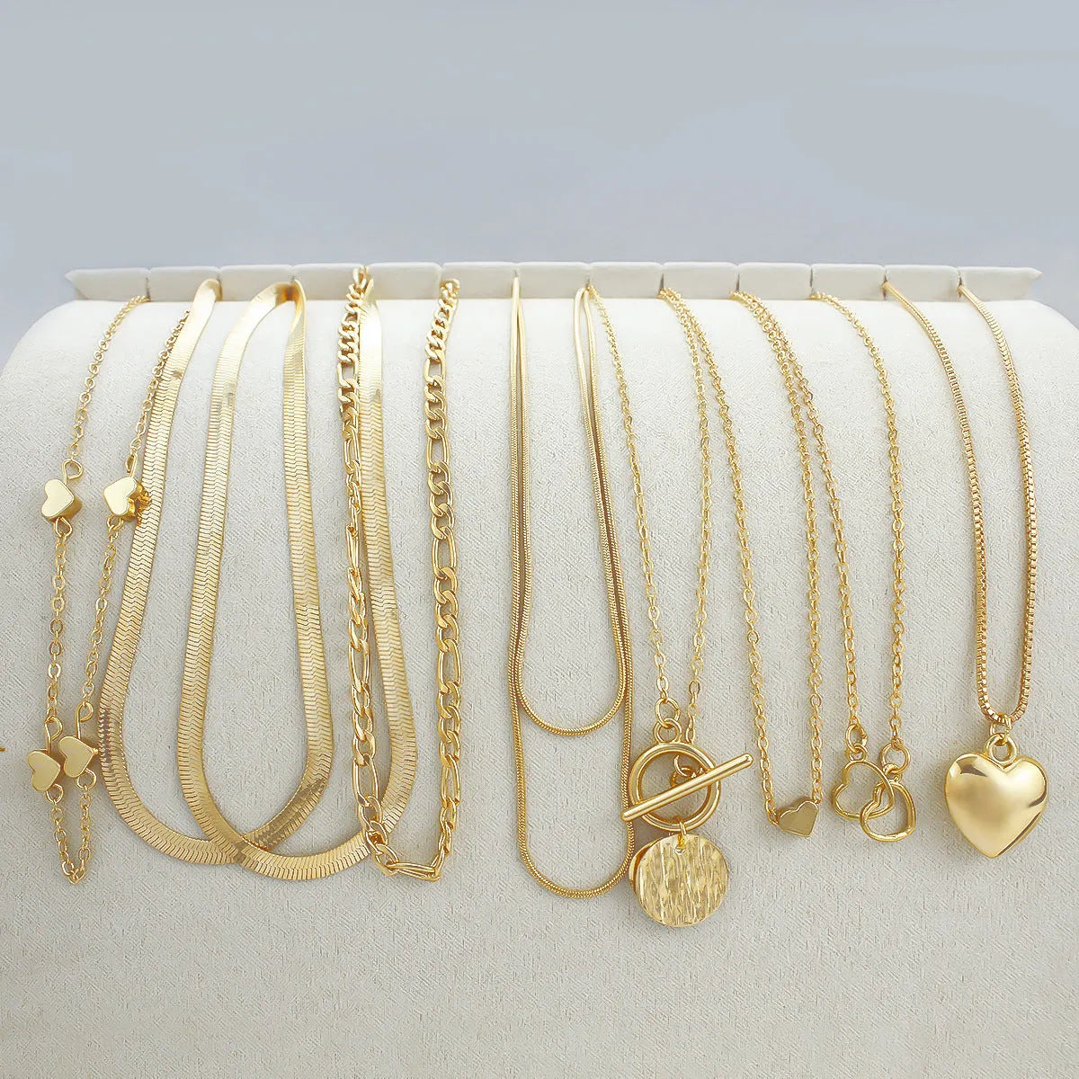 10-piece women's jewellery set with gold necklace featuring alloy pendant on snake bones chain