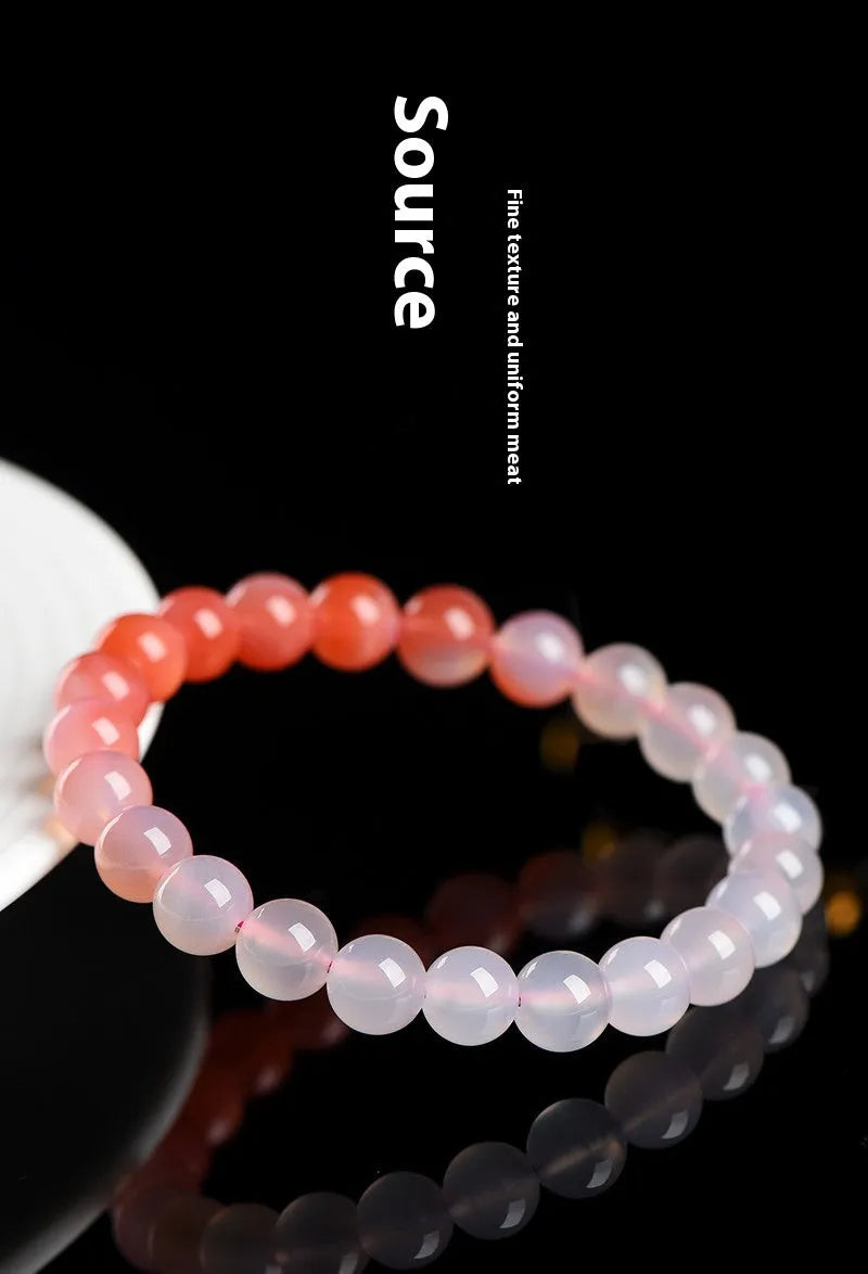 Yanyuan agate bracelet with gradient colours showing beads in a geometric style on a wrist.