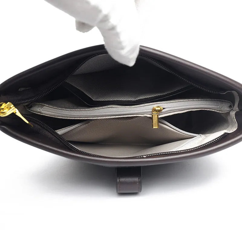 Korean-style black bucket messenger bag showing zipper compartments and adjustable shoulder straps