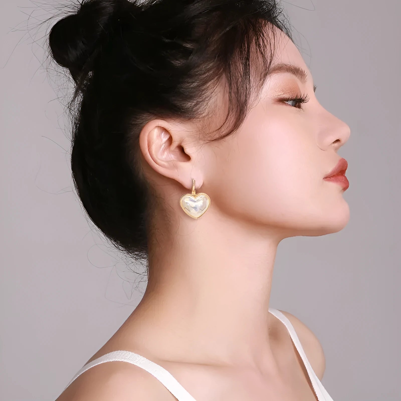 A pair of gold-coloured alloy clip-on earrings for women in a natural style.