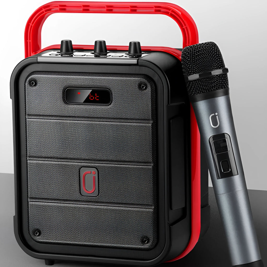 MS62AI portable Bluetooth speaker with wireless microphone on a table, showing control knob and plastic casing.