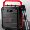 MS62AI portable Bluetooth speaker with wireless microphone on a table, showing control knob and plastic casing.