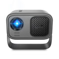 Black portable smart projector with remote control on table
