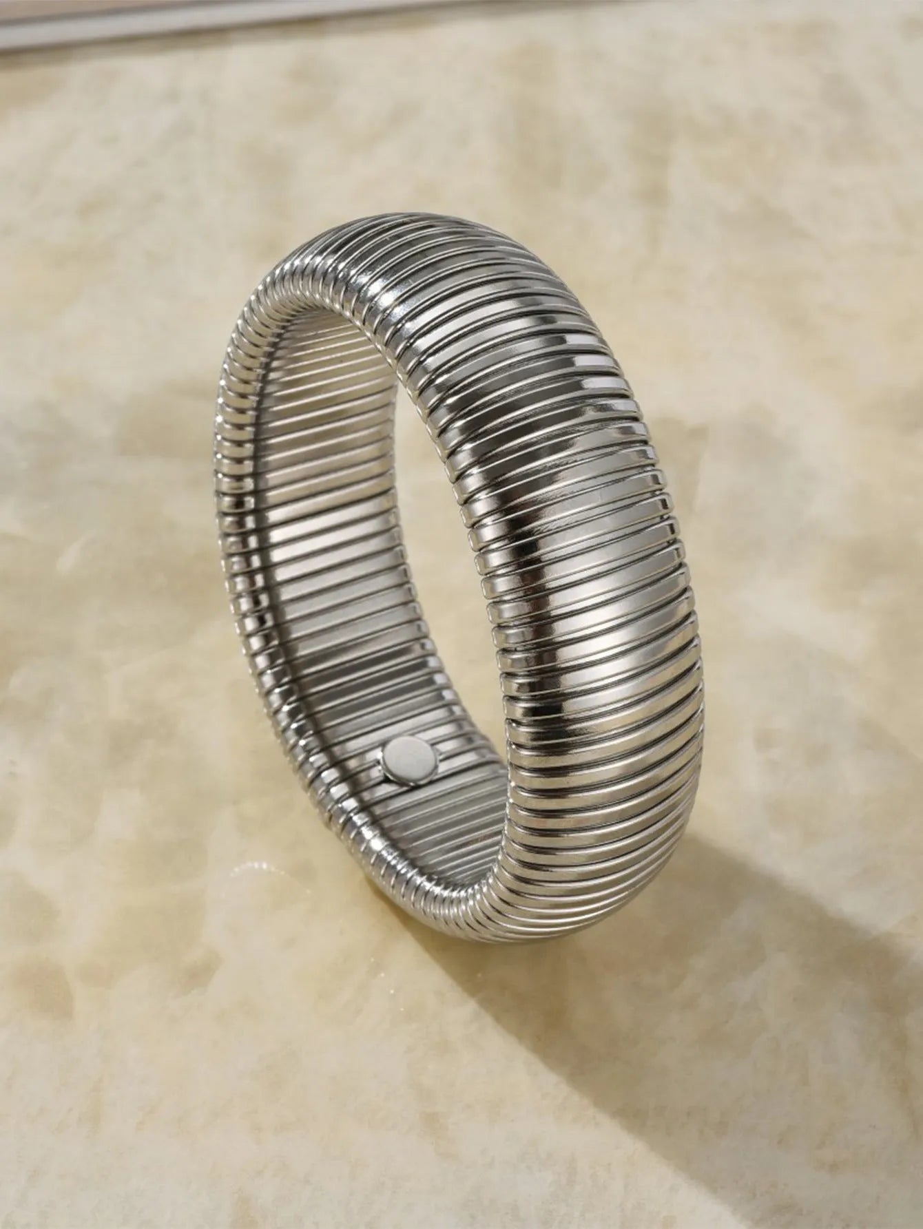Women's titanium steel elastic bracelet with vertical stripe ring pattern in gold electroplated finish