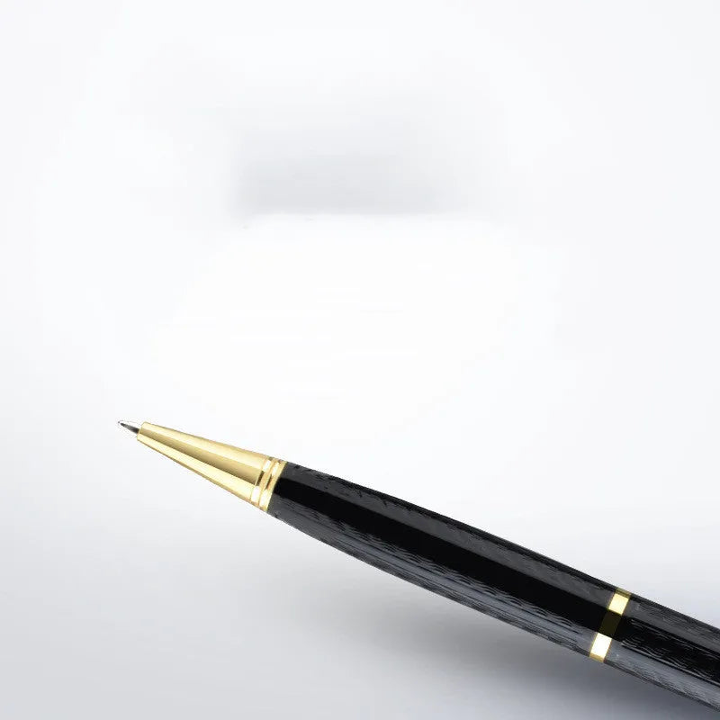 Black pen-shaped digital voice recorder with zinc alloy shell, shown with included headset and cable.