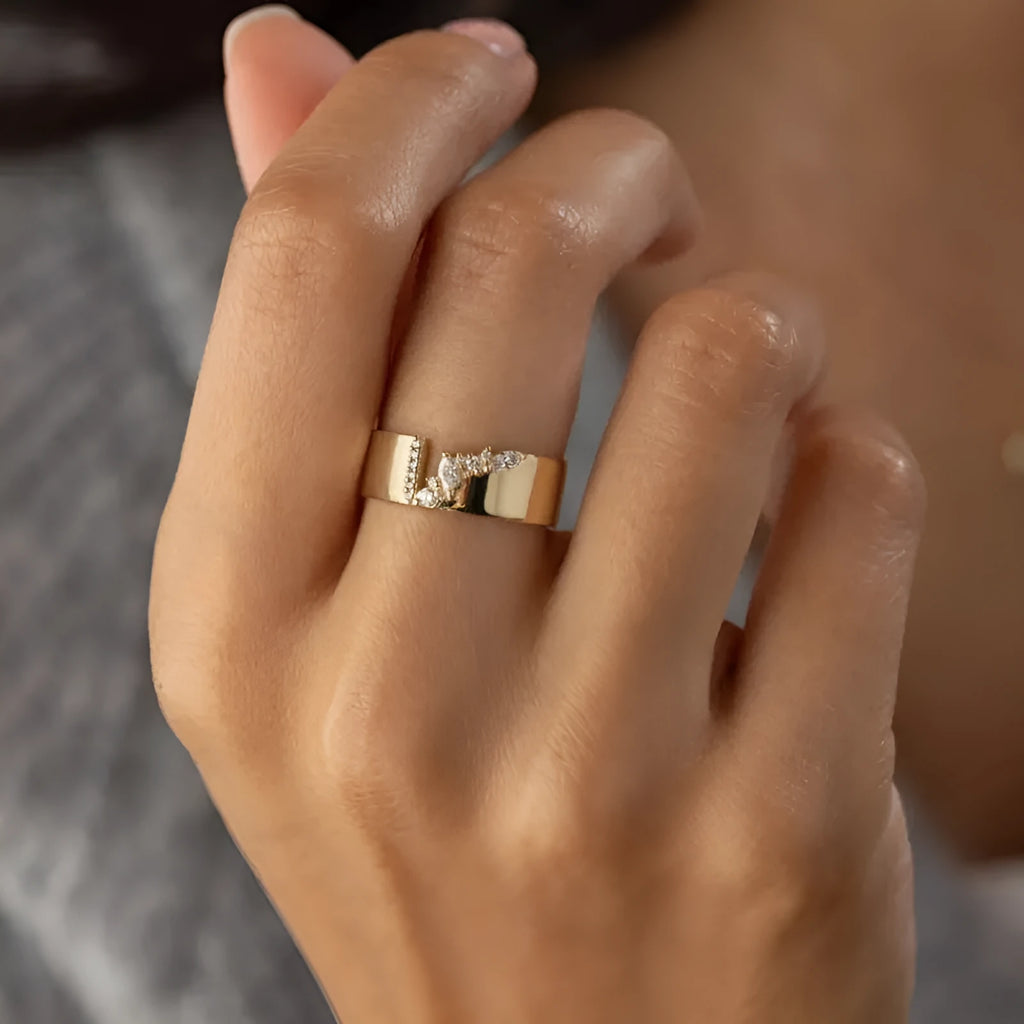 Gold electroplated copper women's fashion ring with shining zircon stones.