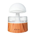 White cloud-shaped aromatherapy humidifier with LED lights and simulated raindrops.