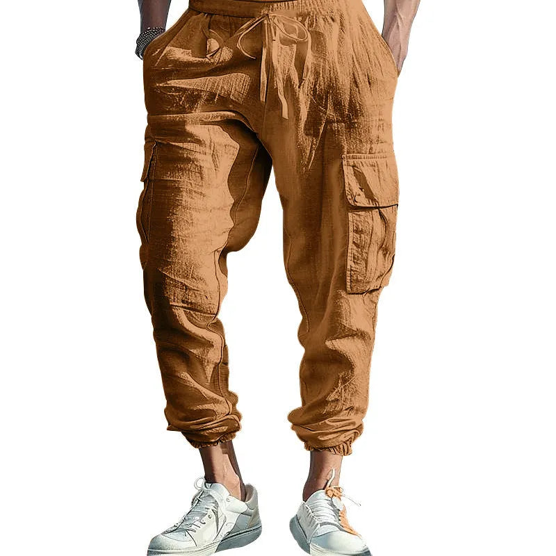 Men's solid colour linen casual trousers with ankle ties and a drawstring waist.