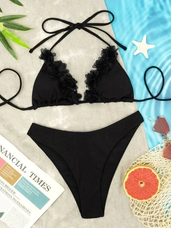 Black women's two-piece polyester swimsuit set with top and shorts on a mannequin