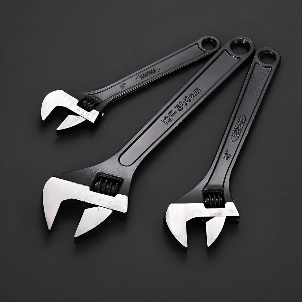 10-inch black high carbon steel adjustable open-end wrench on a workbench.