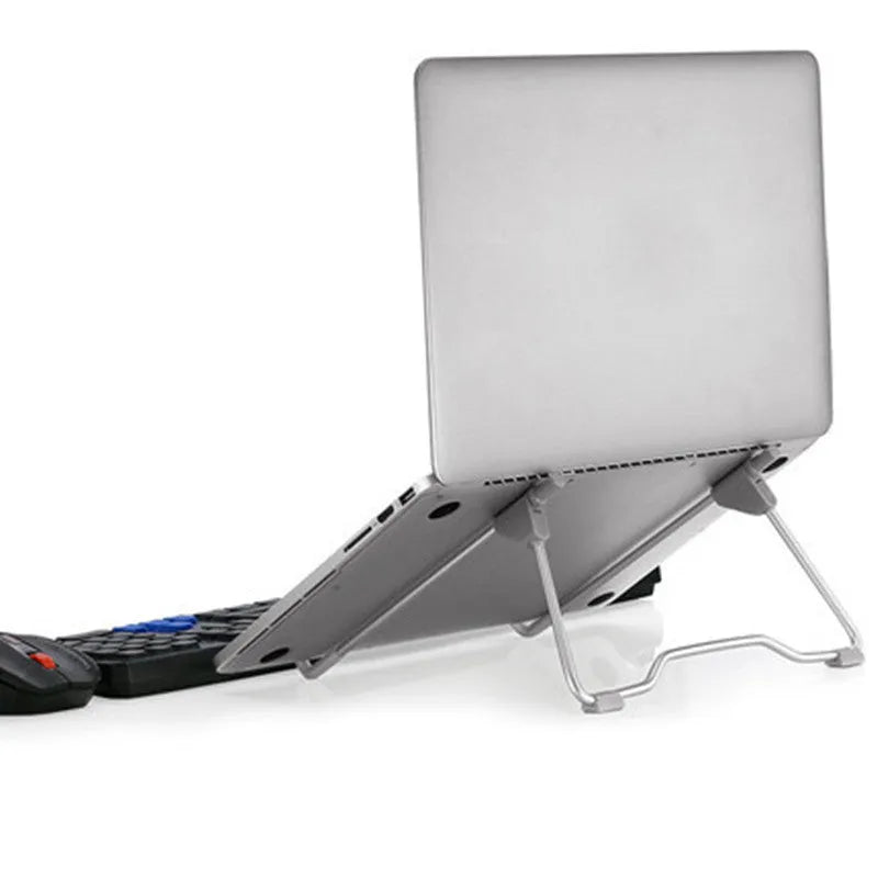 Grey aluminium alloy and engineering plastic mobile phone and laptop stand on a desk.