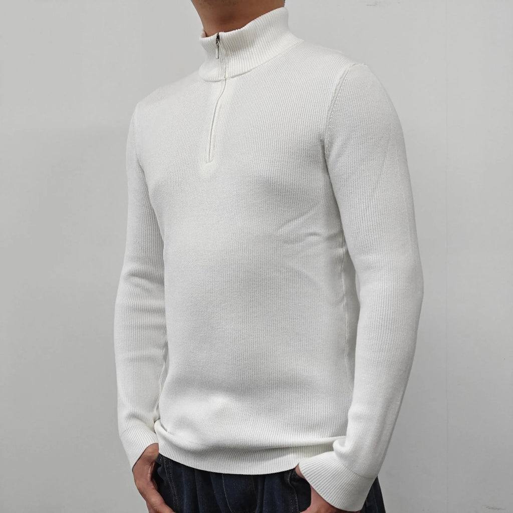 A man's grey half turtleneck zip sweater made from a cotton blend fabric, shown on a hanger.