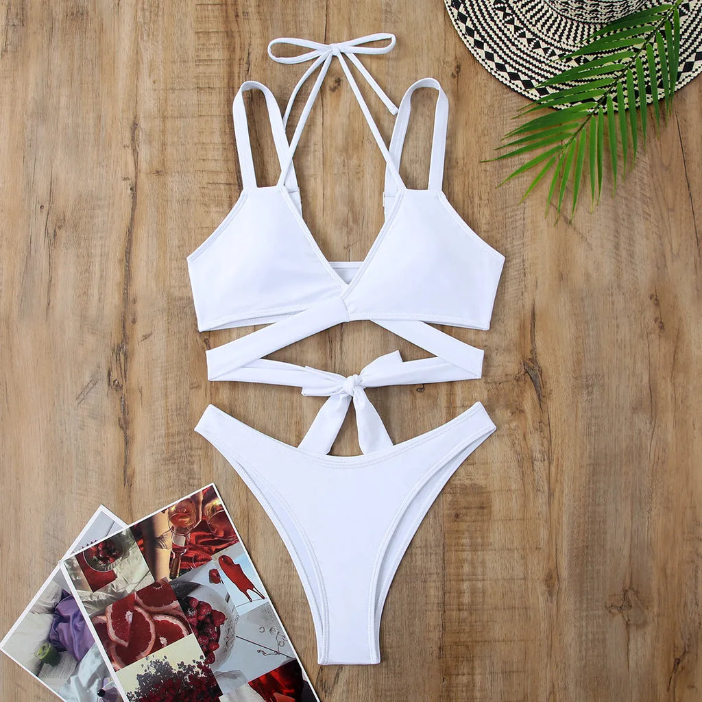Women's solid colour strap bikini swimsuit showing briefs style in one of five colour options