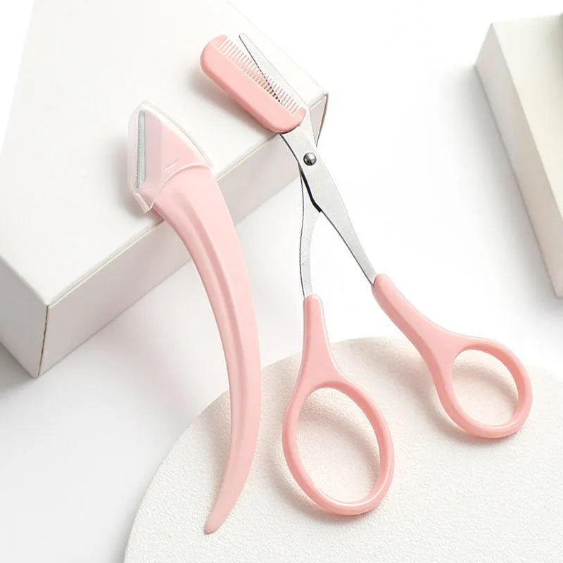 White and pink eyebrow trimming knife with curved blades and comb for brow and lash grooming.