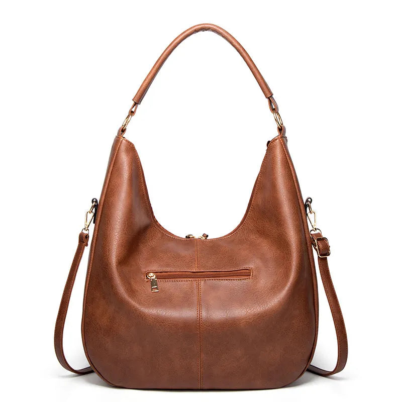 Women's soft PU leather tassel hollow shoulder bag in vertical square shape with sewing line details, black colour