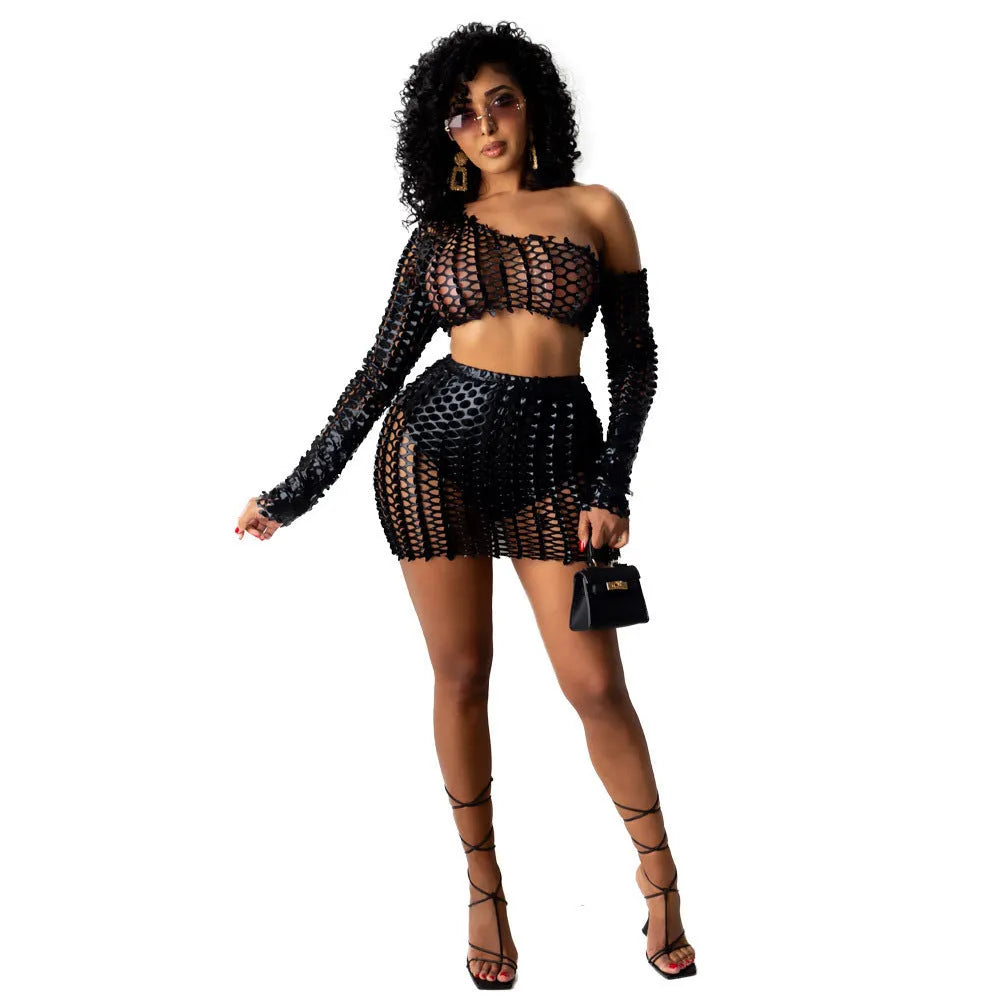 Women's black hollow-out net top and skirt two-piece set for elegant commute wear.