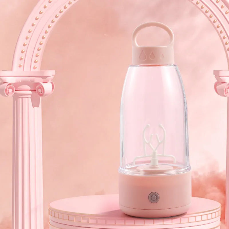 Automatic electric shaker bottle with USB port, handle, and blending motor in green, pink, or white colour.