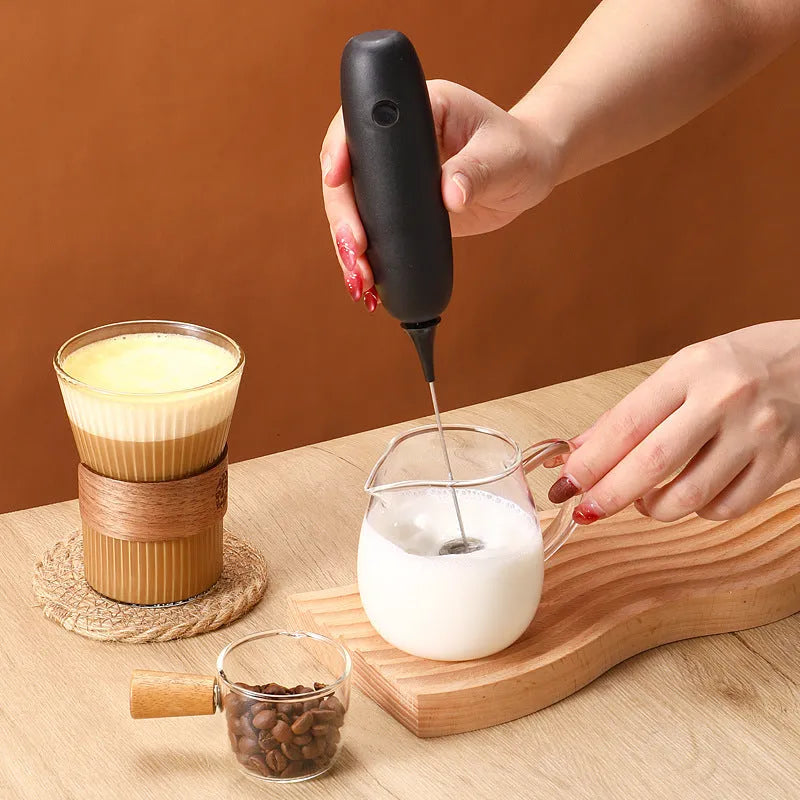 Black and white hand-held electric milk frother blender modern simplicity design