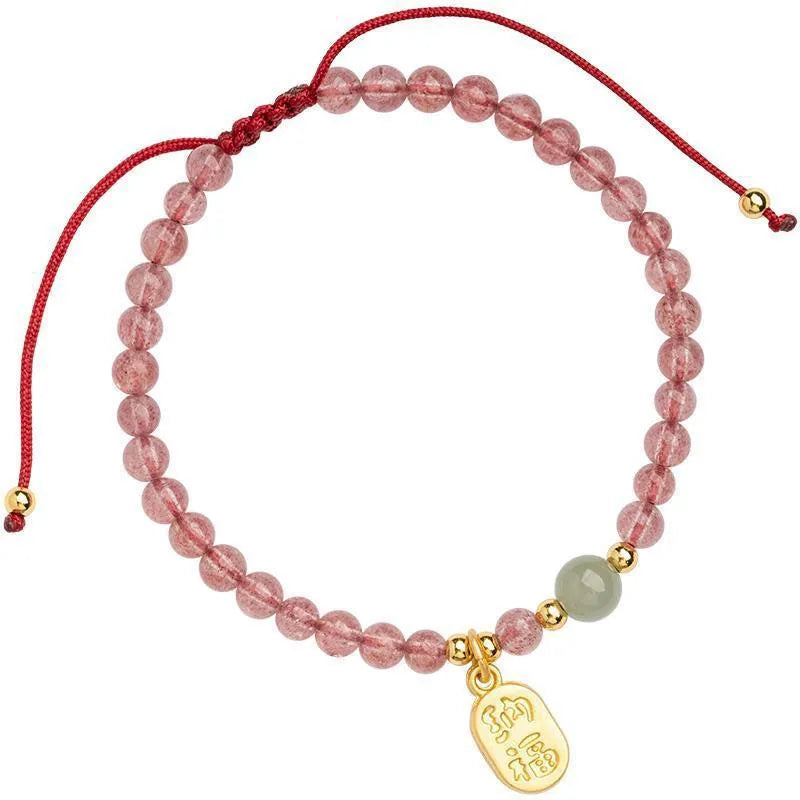 Hand-woven red rope bracelet with strawberry quartz crystals and garnet beads