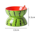 Ceramic elevated cat bowl with tilted design in orange, pitaya, or watermelon pattern.