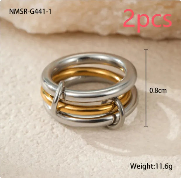 Stacked stainless steel ring set with 18K gold plating, exaggerated design for women.