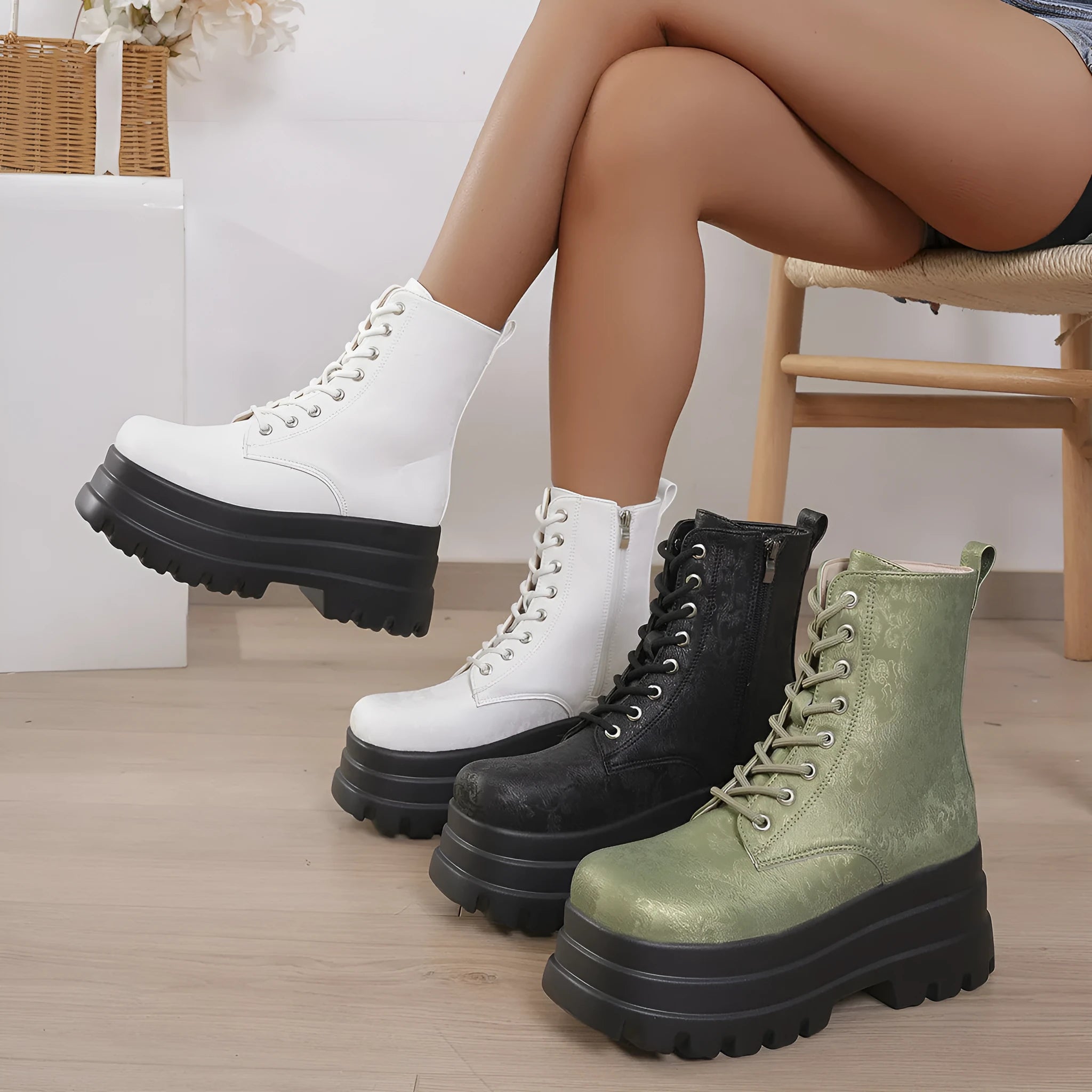Women's white retro platform Martin boots with side zip and chunky heel on a plain background.