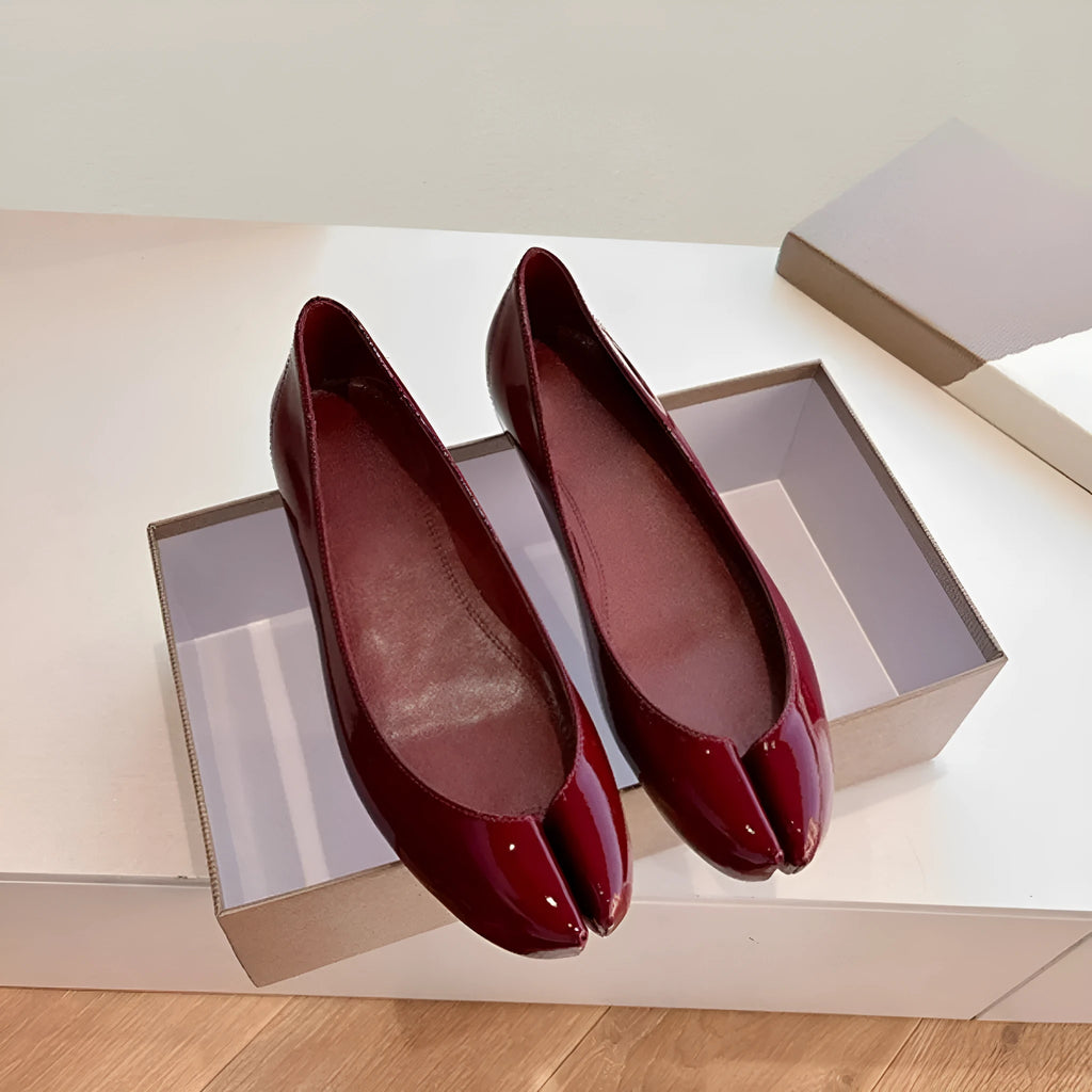 Women's slip-on flat bottom split toe pumps in red with low heel and rubber sole